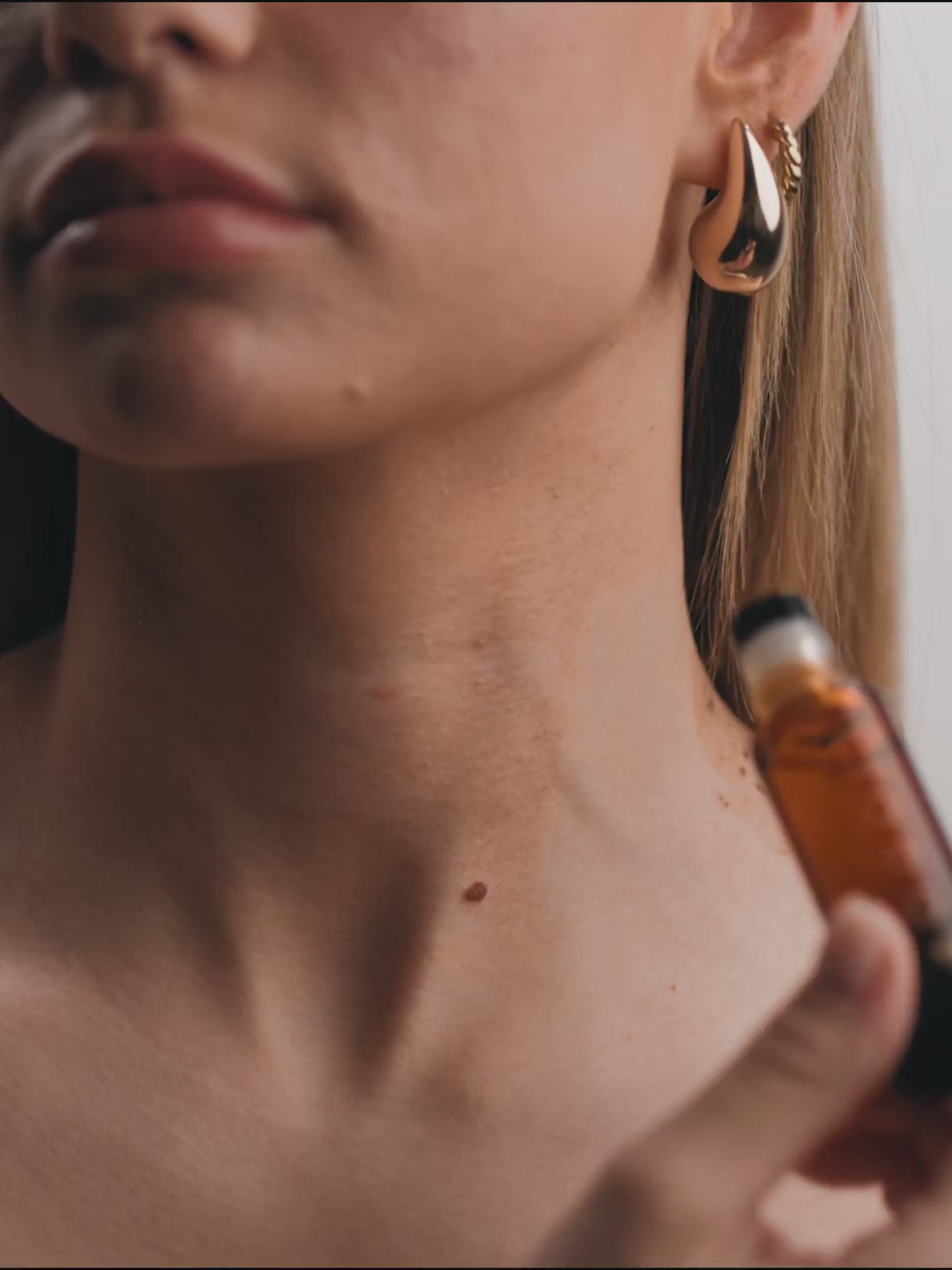 Person using perfume oil